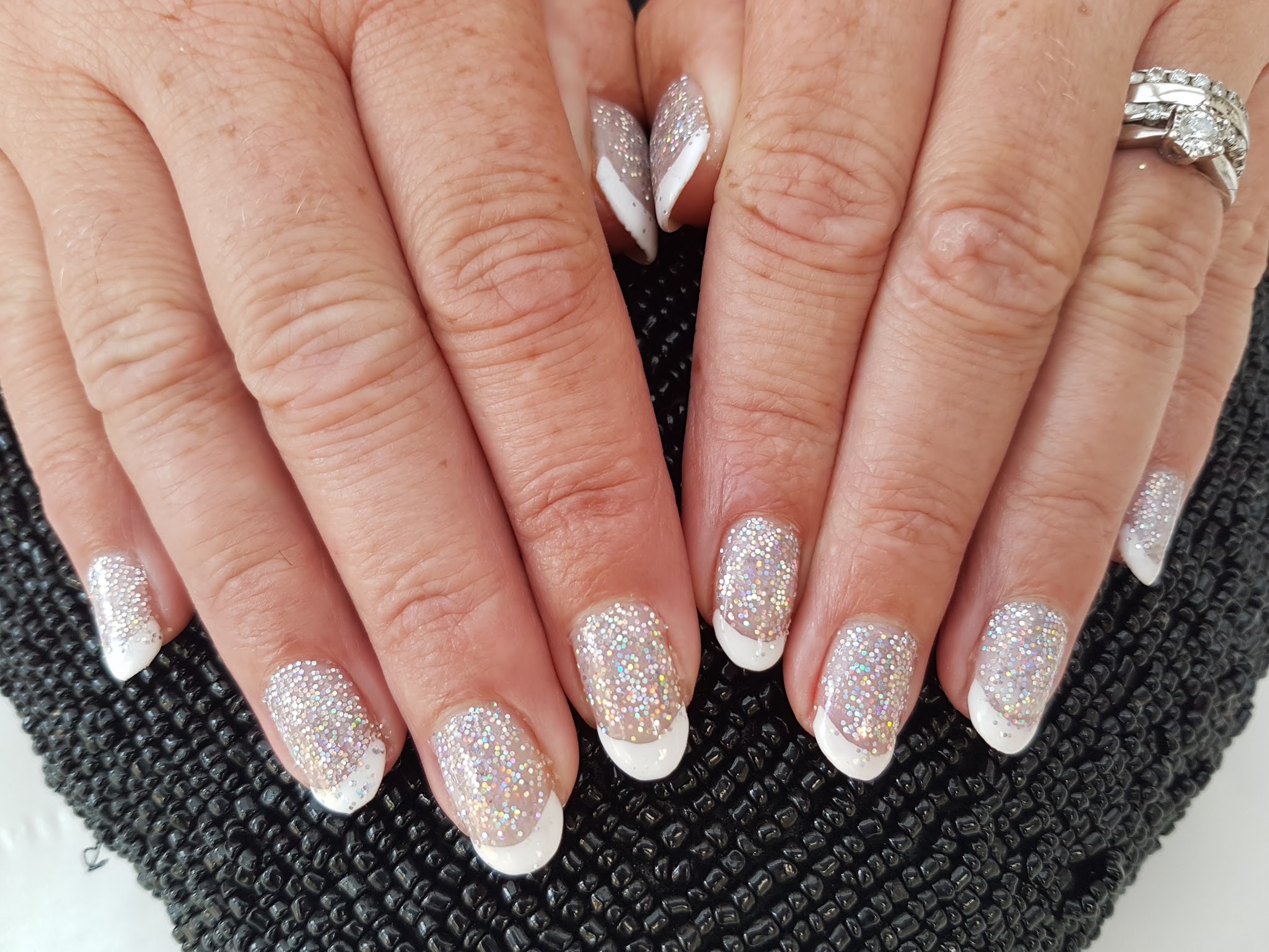 White French tips with delicate silver glitter
